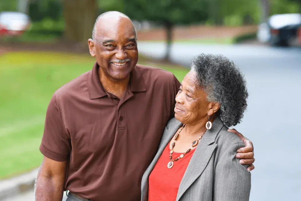 Caring hands supporting elderly person